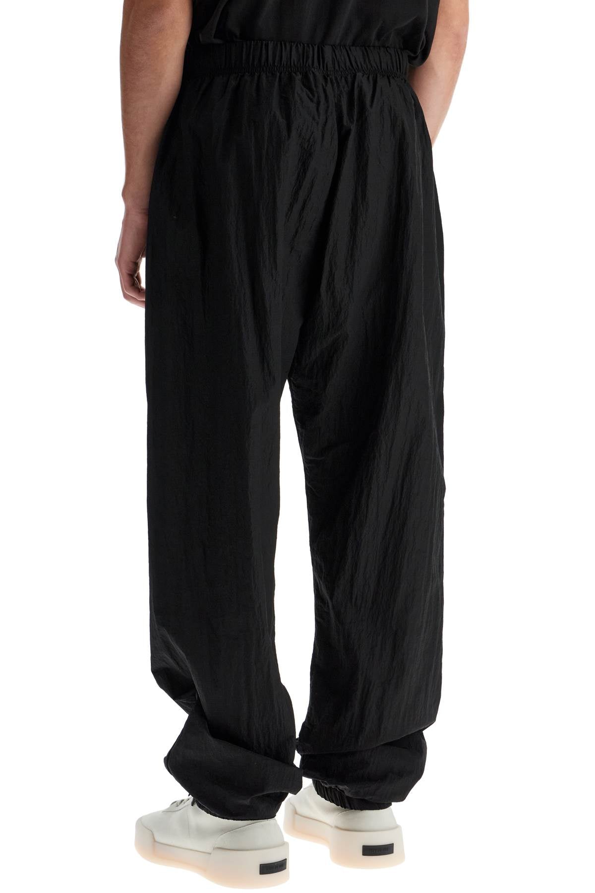 Fear Of God ESSENTIALS nylon ripstop track pants in